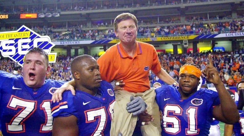 In this Dec. 2, 2000, file photo, Florida head coach Steve Spurrier is carried off the field after the Gators downed Auburn 28-6 in the SEC Championship at the Georgia Done in Atlanta. (John Bazemore/AP)