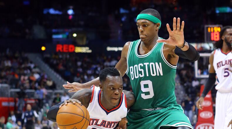 120214 ATLANTA: Hawks guard Dennis Schroder drives against Celtics Rajon Rondo leading the Hawks to a come from behind 109-105 victory in the second half of an NBA basketball game on Tuesday, Dec. 2, 2014, in Atlanta. CURTIS COMPTON / CCOMPTON@AJC.COM
