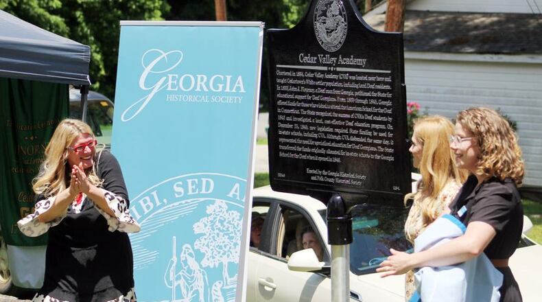 Retired educator Adonia K. Smith (from left), Polk County Historical Society Director Arleigh Johnson and Georgia Historical Society’s Breana James unveil the new historical marker for Cedar Valley Academy during a ceremony on Brooks Street in Cedartown, Georgia. (Photo Courtesy of Jeremy Stewart)