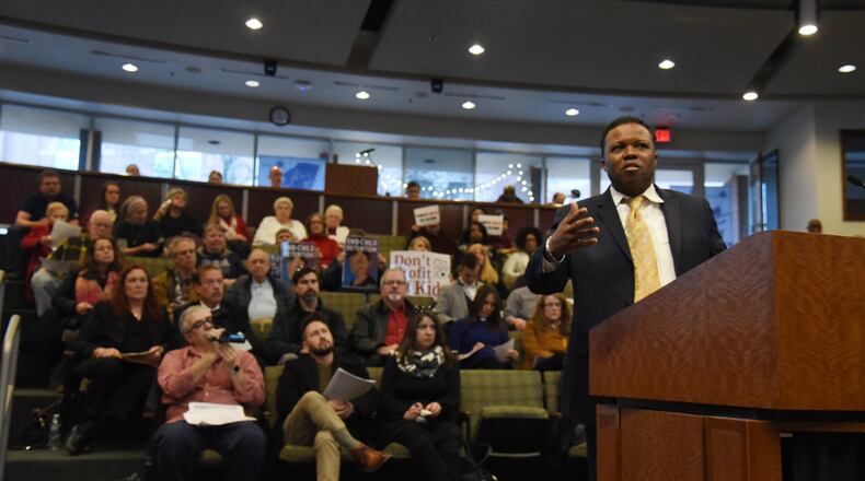 Pastor Mitchell Bryant speaks to members of the city council during Marietta City Council special meeting on Wednesday, December 11, 2019. The Marietta City Council will consider whether to grant a variance to allow Freemont Grace Human Services to operate a shelter that would house unaccompanied immigrant children seized from the U.S.-Mexico border. Mitchell Bryant, a pastor and managing partner with the organization, wants to use a vacant building at 119 Powers Ferry Road to house up to 50 children in custody of the U.S. Department of Health and Human Services. Bryant obtained approval in October from the city’s Zoning Board of Appeals to use the building as a shelter. (Hyosub Shin / Hyosub.Shin@ajc.com)