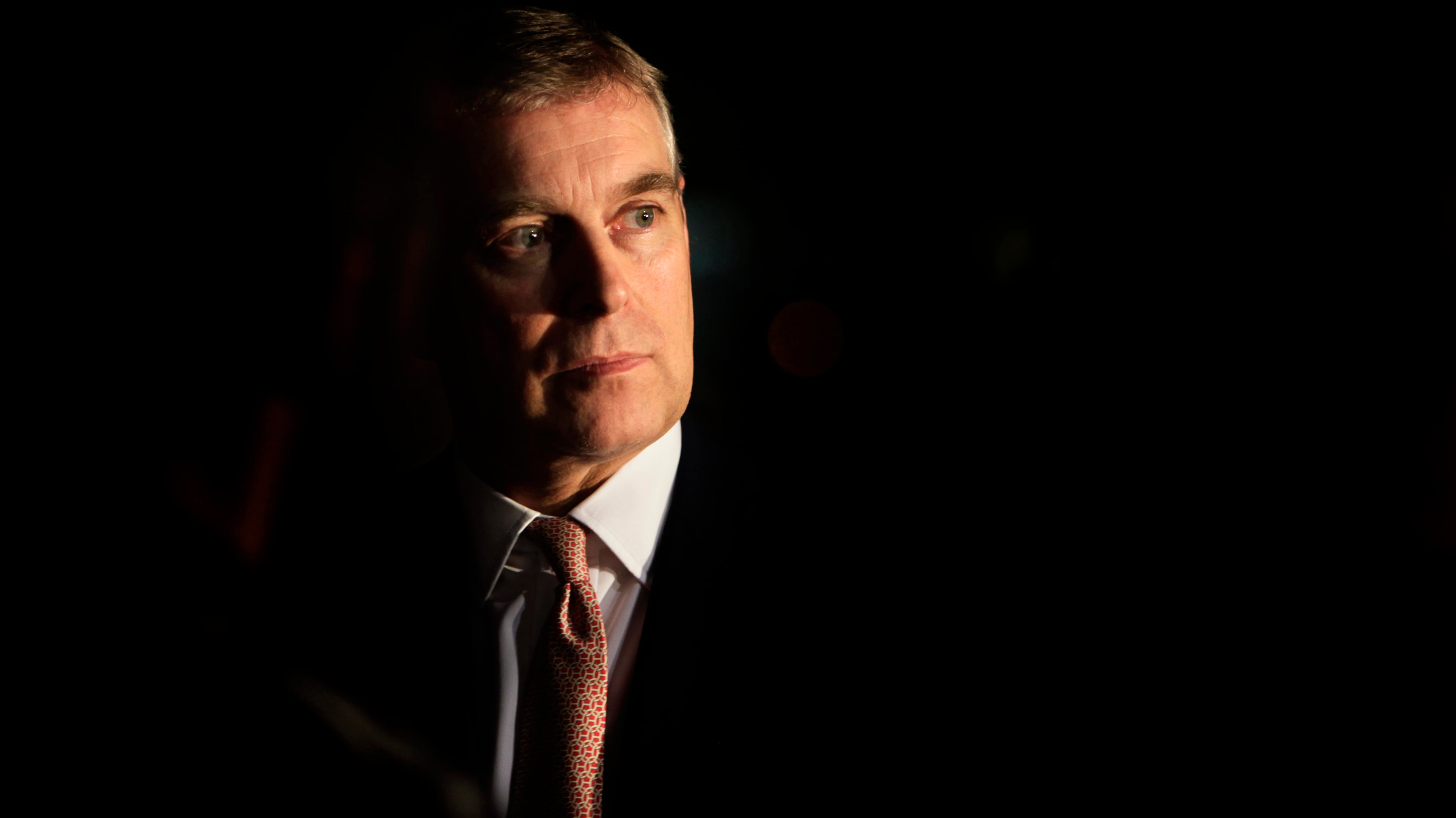 FILE - Britain's Prince Andrew looks on during an event at the residence of the British Ambassador in New Delhi, India, March 10, 2010. (AP Photo/Manish Swarup, File)