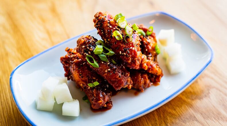 Korean Fried Chicken Wings are among the hot appetizers at Salaryman. CONTRIBUTED BY HENRI HOLLIS