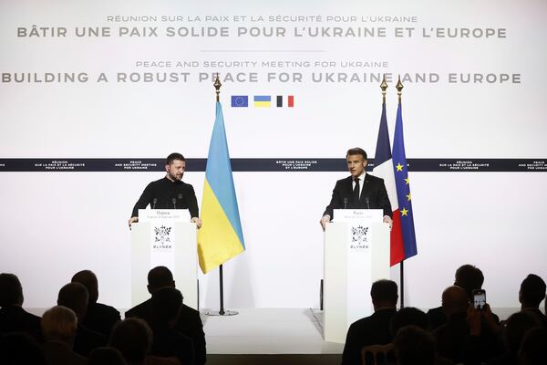 Ukrainian President Volodymyr Zelenskyy, left, gives a press conference with French President Emmanuel Macron following a bilateral meeting at the Elysee Palace in Paris, Wednesday, March 26, 2025. (Yoan Valat, Pool via AP)
