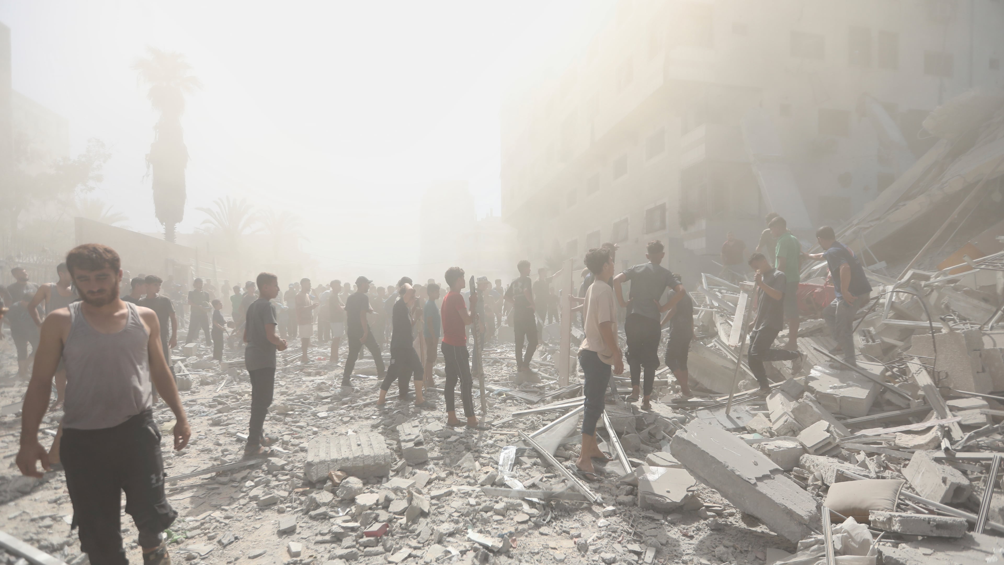 Palestinians inspect the rubble of a building after an Israeli military strike in Gaza City, Sunday, Sept. 14, 2025. (AP Photo/Yousef Al Zanoun)