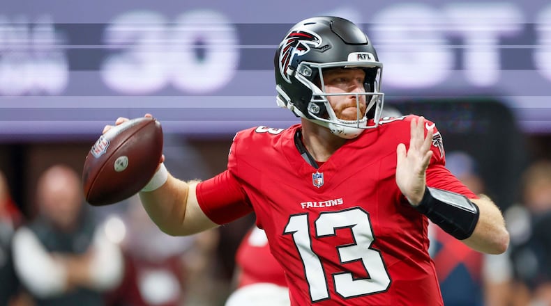 Falcons quarterback Cooper Rush attempts a pass in the first half Sunday, Sept. 20, 2026, against the Panthers at Mercedes-Benz Stadium in Atlanta. Rush went 10-for-17 passing for 86 yards, no touchdowns, two interceptions and a lost fumble. (Miguel Martinez/AJC)