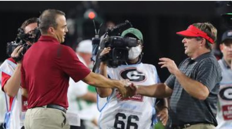 "I know it’ll be a big, big, big challenge for us," South Carolina coach Shane Beamer (left) says of facing Kirby Smart in November. (Curtis Compton/AJC 2022)
