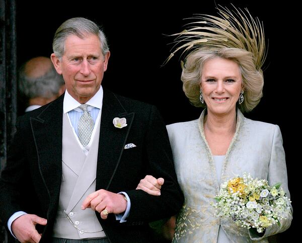 FILE - Britain's Prince Charles and his bride Camilla Duchess of Cornwall leave St George's Chapel in Windsor, England following the church blessing of their civil wedding ceremony, Saturday, April 9, 2005. (AP Photo/ Alastair Grant, Pool, File)
