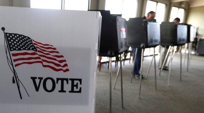 Around 1 in 5 voters nationwide report themselves as undecided or flirting with third-party candidates, with the exact share depending on the poll and how the question is asked. (AP Photo/M. Spencer Green, File)