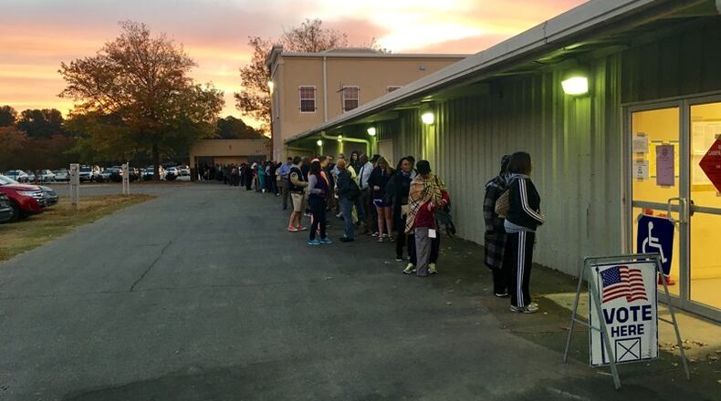 More than 100 people were lined up to vote at the Gwinnett County Fairgrounds in Lawrenceville before polls opened at 7 a.m. Tuesday.