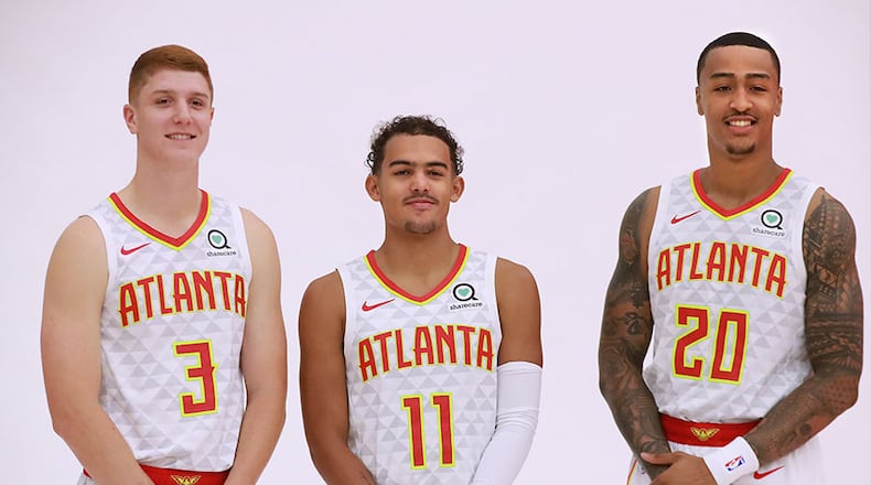 Hawks team core members Kevin Huerter (from left), Trae Young and John Collins pose for a team portrait during media day Monday, Sept. 30, 2019, at the Hawks training facility, the Emory Sports Medicine Complex, in Atlanta.