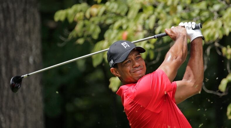 FILE - In this Aug. 23, 2015, file photo, Tiger Woods watches his tee shot on the second hole during the final round of the Wyndham Championship golf tournament at Sedgefield Country Club in Greensboro, N.C. Tiger Woods has posted a video of him swinging a 9-iron in a golf simulator. His agent says the video was posted to rebut rumors on social media that he had taken a turn for the worse following two back surgeries last fall. Mark Steinberg of Excel Sports Management said Monday, Feb. 22, 2016, that the rumors were ridiculous. (AP Photo/Chuck Burton, File)