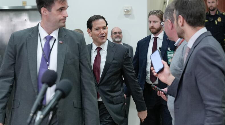 Secretary of State Marco Rubio, center, arrives to brief lawmakers on the U.S. military strikes on alleged drug boats ordered by President Donald Trump, on Capitol Hill, Wednesday, Nov. 5, 2025, in Washington. (AP Photo/Mariam Zuhaib)