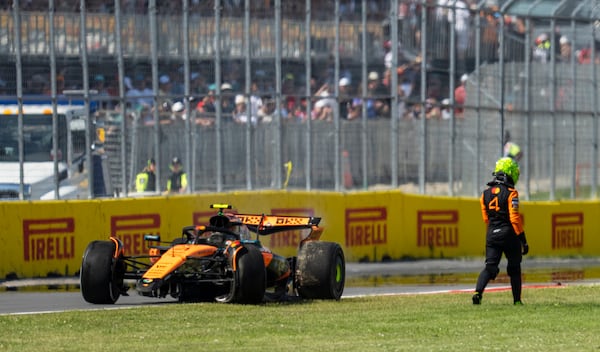 McLaren driver Lando Norris, of the United Kingdom, walks away from his car following a collision during Formula One auto racing action at the Canadian Grand Prix in Montreal, Sunday June 15, 2025. Christopher Katsarov/The Canadian Press via AP)