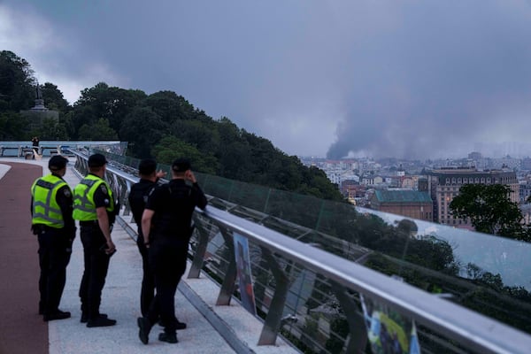 Smoke rises after Russian drone strike on Kyiv, Ukraine, Tuesday, June 10, 2025. (AP Photo/Evgeniy Maloletka)