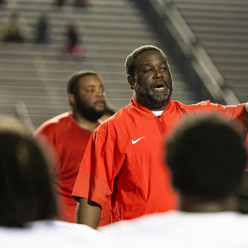 Sandy Creek head coach Darius Smiley addresses the team after the Patriots won 21-0 against Douglas County on Friday, Aug. 28, 2026. (Oscar Guevara Saenz for the AJC)