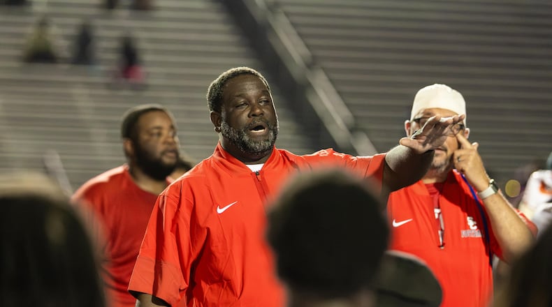 Sandy Creek head coach Darius Smiley addresses the team after the Patriots won 21-0 against Douglas County on Friday, Aug. 28, 2026. (Oscar Guevara Saenz for the AJC)