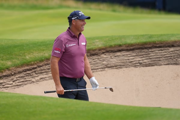Pidgin Harrington of Ireland looks to play out of a bunker on the 13th green during a practice round for the British Open golf championship at the Royal Portrush Golf Club, Northern Ireland, Tuesday, July 15, 2025. (AP Photo/Jon Super)