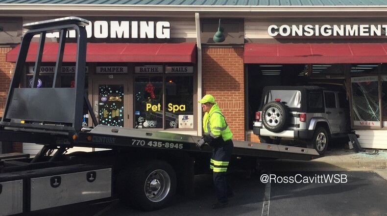 A Jeep rammed a Cobb County consignment shop Friday morning. (Credit: Ross Cavitt, Channel 2 Action News)
