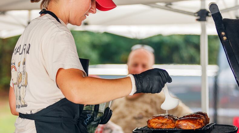 Bring the wet wipes! It’s time for Kennesaw’s annual Pigs and Peaches barbecue festival. Contributed