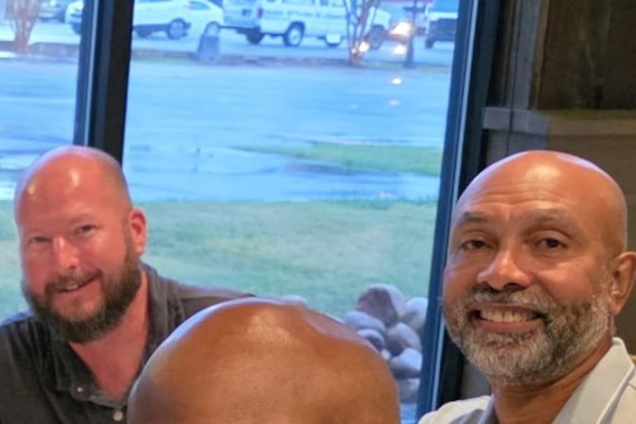Ernie Strauss (left), a financial executive, and Ron Wakefield, an official with the state, share a common bond and dinner. They meet with others who are or have battled prostate cancer. The monthly gatherings are an extension of their support group meetings on a topic men generally don't want to talk about, including the treatment side effect of erectile dysfunction. (Courtesy Northside Hospital Atlanta)