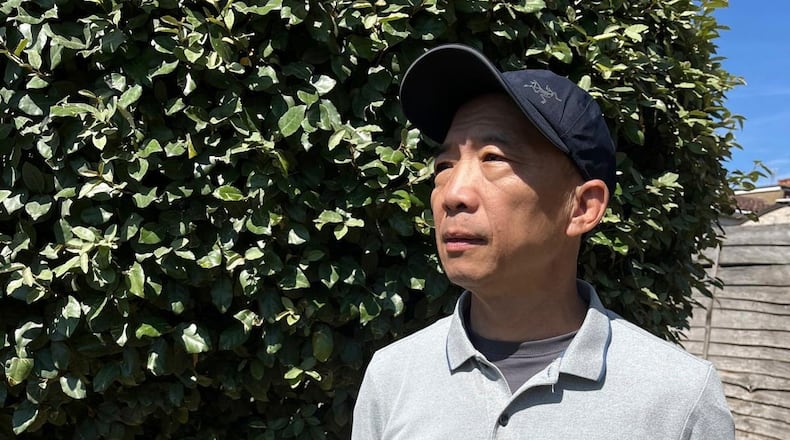 This photo released by Hong Kong's former pro-democracy lawmaker Wu Chi-wai show's himself posing for a portrait in London, Saturday, July 25, 2026. (Wu Chi-wai via AP)