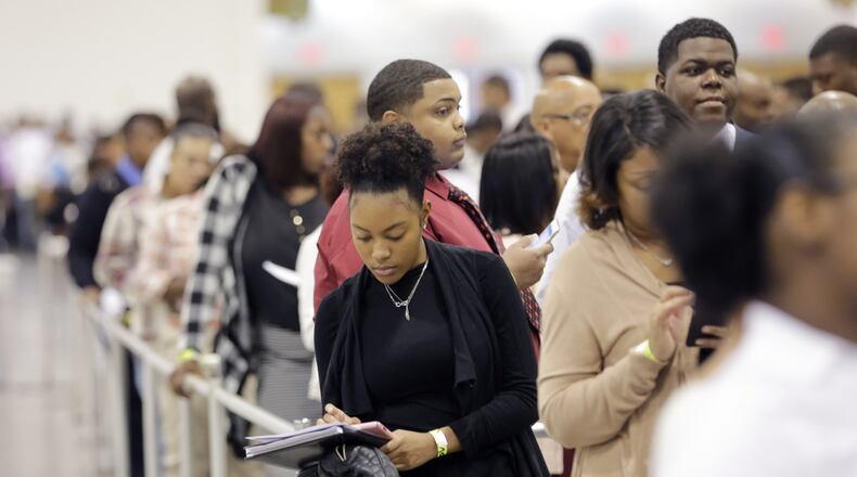 The city is joining with a private sector group for a job fair on May 3. Experts say that a disproportionate share of young people are not in the labor market. Here, a job fair in 2016. BOB ANDRES /BANDRES@AJC.COM