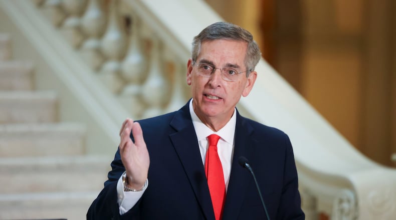 Secretary of State Brad Raffensperger is the latest Georgia politician to challenge the state's campaign finance laws. He says the laws give rival Lt. Gov. Burt Jones an illegal advantage as they campaign for the Republican nomination for governor. (Jason Getz/AJC).