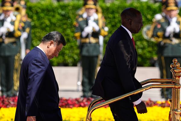 Chinese President Xi Jinping, left, and Kenyan President William Ruto attend a welcome ceremony at the Great Hall of the People Thursday, April 24, 2025 in Beijing, China. (Iori Sagisawa/Pool Photo via AP)