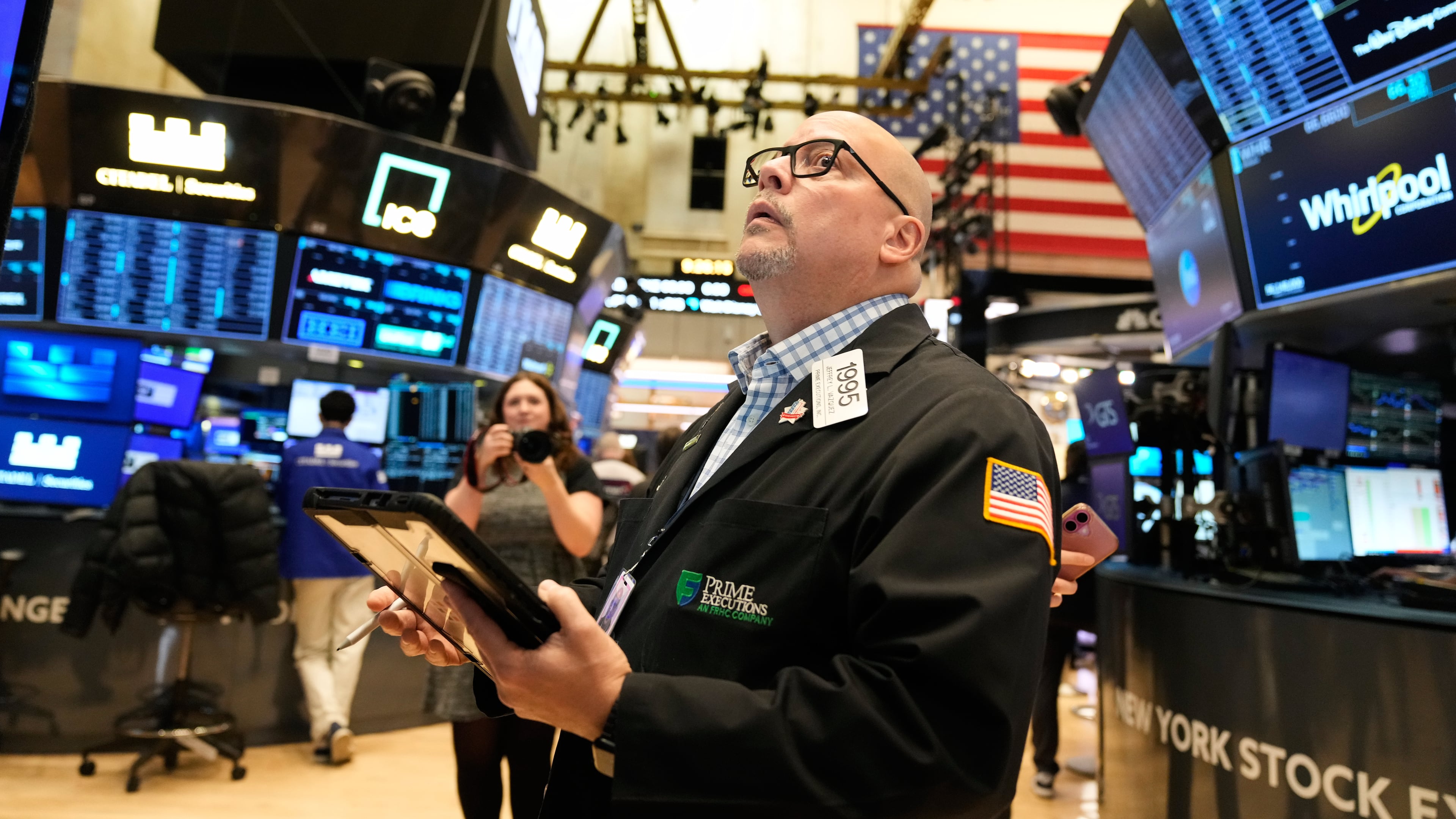 Jeffrey Vazquez works on the floor at the New York Stock Exchange in New York, Thursday, Nov. 13, 2025. (AP Photo/Seth Wenig)