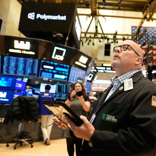 Jeffrey Vazquez works on the floor at the New York Stock Exchange in New York, Thursday, Nov. 13, 2025. (AP Photo/Seth Wenig)