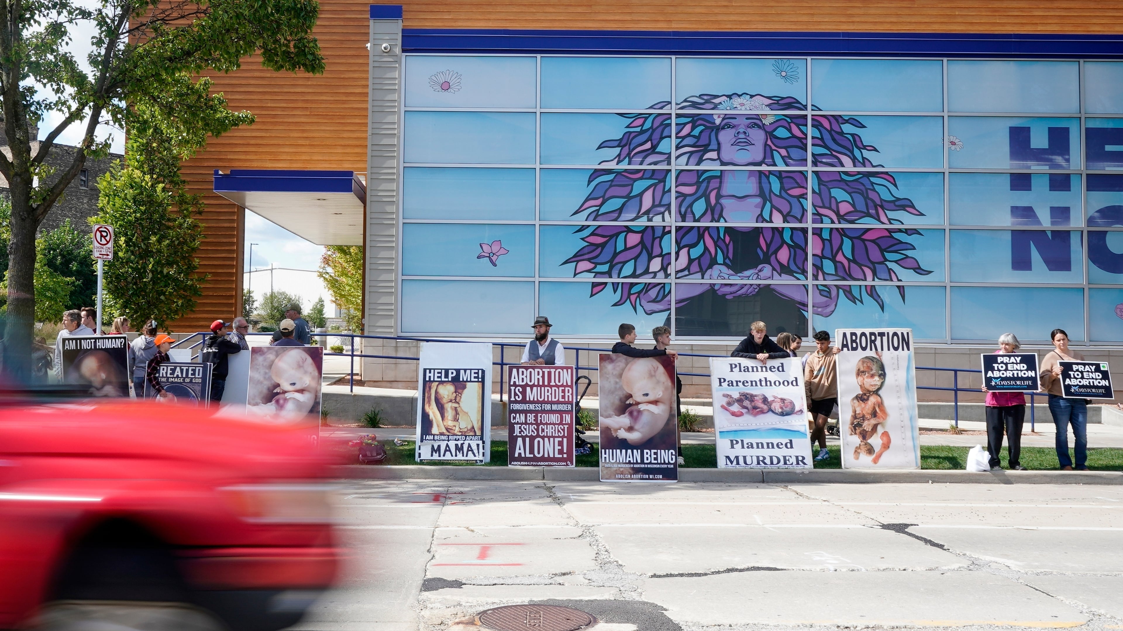 FILE - Protesters are seen outside Planned Parenthood, Sept. 18, 2023, in Milwaukee. (AP Photo/Morry Gash, File)
