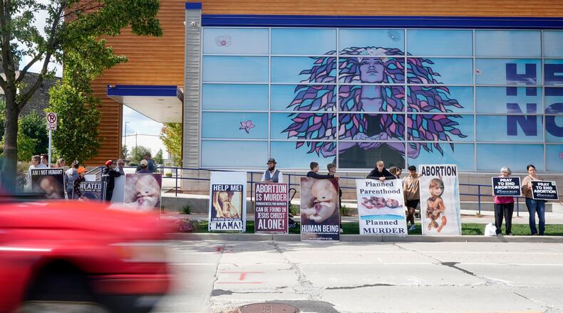 FILE - Protesters are seen outside Planned Parenthood, Sept. 18, 2023, in Milwaukee. (AP Photo/Morry Gash, File)