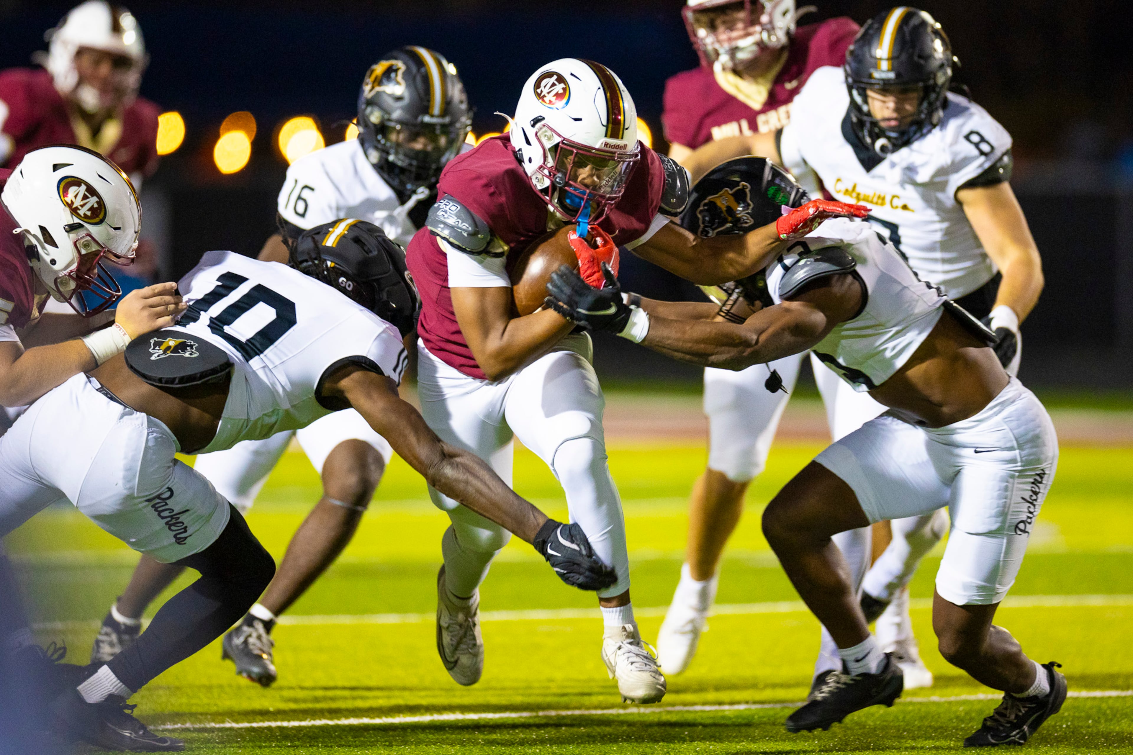 Mill Creek running back Nick Tuck (34) is brought down by Colquitt County defenders during the first half at Mill Creek Community Stadium, Friday, Nov. 14, 2025, in Hoschton, Ga. (Oscar Guevara Saenz for the AJC)