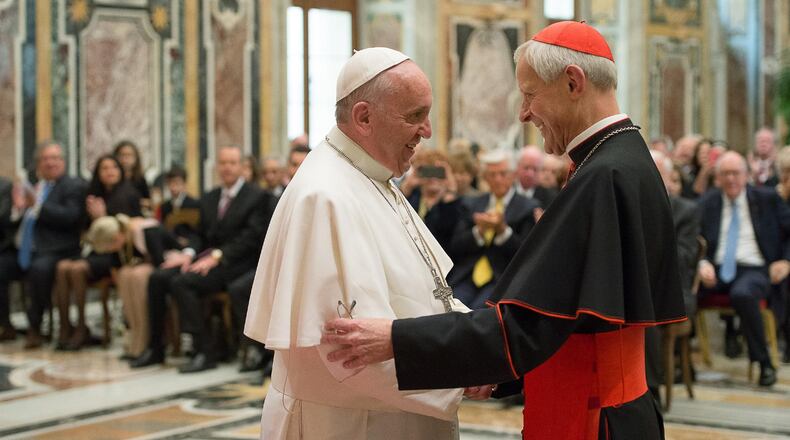 In this file photo, Pope Francis (left) talks with Papal Foundation Chairman Cardinal Donald Wuerl, archbishop of Washington, D.C., during a meeting with members of the Papal Foundation at the Vatican. Earlier this month, a Pennsylvania grand jury accused Wuerl of helping to protect abusive priests when he was Pittsburgh’s bishop. A Pew Research Center survey in January found a drop (from 55 percent to 45 percent) in the share of U.S. Catholics who give the pope “excellent” or “good” marks for his handling of the sex abuse scandal. L’OSSERVATORE ROMANO / POOL PHOTO VIA AP