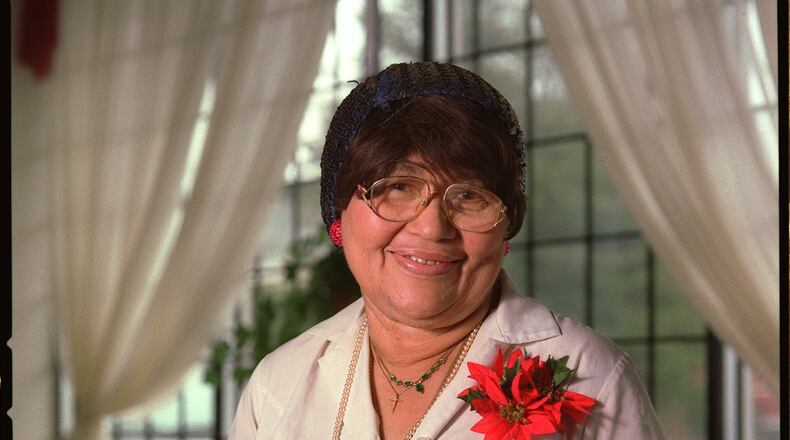 Thelma Grundy in with a small green leather Bible that she received as a gift and frequently carried with her. She and her family ran Thelma’s Kitchen, a landmark Atlanta restaurant serving soul food. JEAN SHIFRIN AJC staff