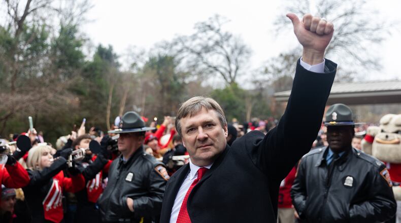 Georgia Bulldog Coach Kirby Smart waves to fans during the Dawg Walk as part of the team’s celebration parade in Athens, Georgia on January 15th, 2022. (Nathan Posner for The Atlanta Journal-Constitution)