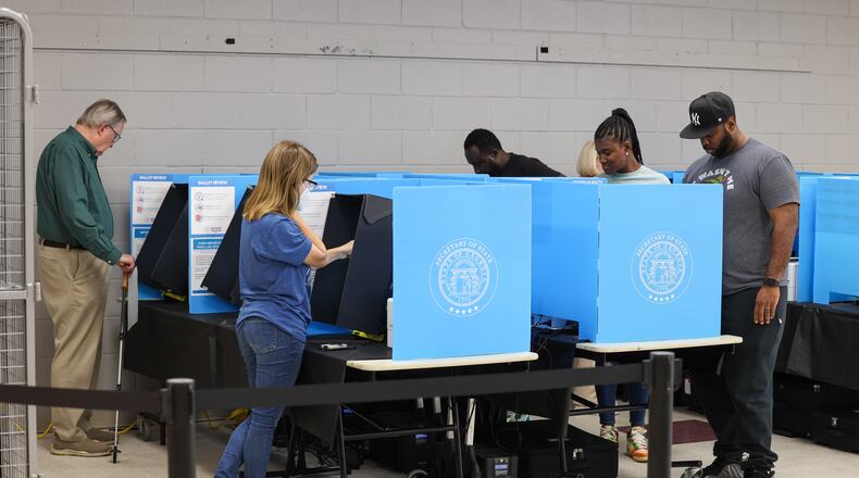Voters cast their ballots at The Nett Church at Berkmar Church in Lilburn. PHIL SKINNER FOR THE ATLANTA JOURNAL-CONSTITUTION