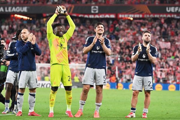 Manchester United's Christian Eriksen, Manchester United's goalkeeper Andre Onana, Manchester United's Harry Maguire, Manchester United's Luke Shaw, from left, celebrate their victory at the Europa League semifinal first leg soccer match between Athletic Bilbao and Manchester United at the San Mames stadium in Bilbao, Spain, Thursday, May 1, 2025. (AP Photo/Miguel Oses)