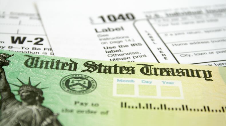 Tax Refund Check with W-2 and 1040 U.S. Individual Income Tax Return Forms (Getty Images/TNS)