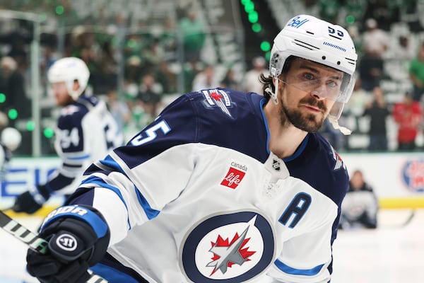 Winnipeg Jets center Mark Scheifele warms up before Game 6 of a second-round NHL hockey playoff series against the Dallas Stars in Dallas, Saturday, May 17, 2025. (AP Photo/Gareth Patterson)