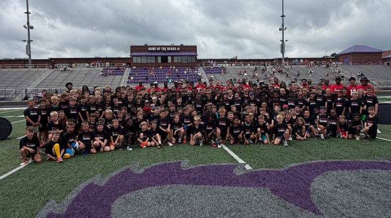 Falcons rookies take a photograph with youth camp participants at Cherokee Bluff High School in Flowery Branch on Monday, June 22, 2026. (Daniel Flick/AJC)