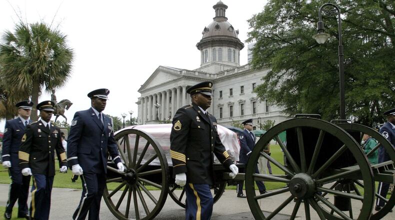 The casket of U.S. Sen. Strom Thurmond, R-S.C., leaves the South Carolina Statehouse, Tuesday, July 1, 2003, for funeral services at the First Baptist Church in Columbia, S.C. (Photo: Bruce Flashnick / Associated Press 2003)