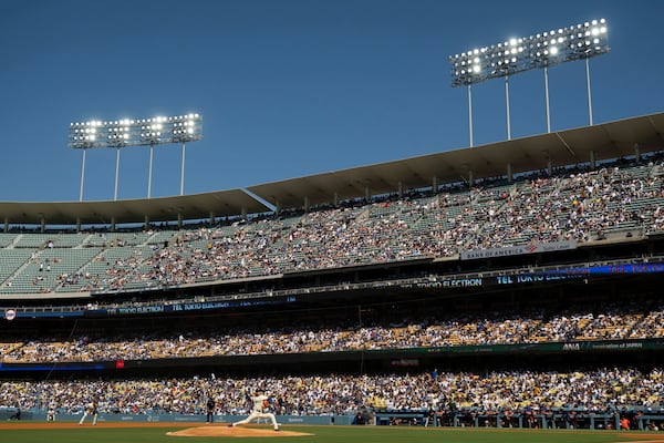 Los Angeles Dodgers starting pitcher Shohei Ohtani delivers during the first inning of a baseball game against the Houston Astros in Los Angeles, Saturday, July 5, 2025. (AP Photo/Kyusung Gong)