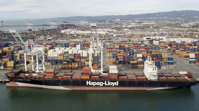 The Rotterdam Express is seen at the Port of Oakland, Wednesday, Oct. 6, 2021 in Oakland, Calif. The Rotterdam Express, a massive cargo ship made a series of unusual movements while anchored in the closest spot to a Southern California oil pipeline that ruptured and sent crude washing up on beaches, according to data collected by a marine navigation service. (AP Photo/Josh Edelson)