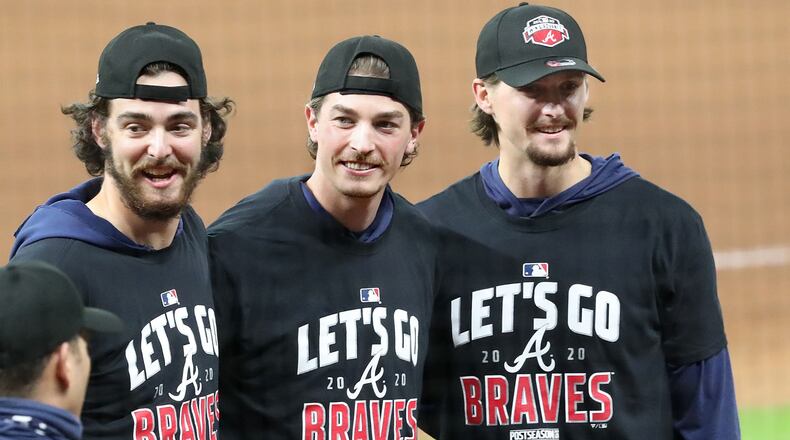 Atlanta Braves starting pitchers Ian Anderson (from left), Max Fried and Kyle Wright celebrate advancing to the NL Championship Series by defeating the Marlins 7-0 in Game 3 of the National League Division Series on Thursday, Oct. 8, 2020 at Minute Maid Park in Houston, Texas. The Braves completed their second consecutive postseason series sweep. (Curtis Compton/Atlanta Journal-Constitution/TNS)