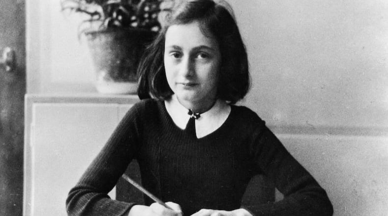 Anne Frank, German Jew who emigrated with her family to the Netherlands during the Nazi era. Separated from the rest of her family, she and her sister died of typhoid fever in the concentration camp Bergen-Belsen - As a 12-year old doing her homework - 1941 (Photo by ADN-Bildarchiv/ullstein bild via Getty Images)