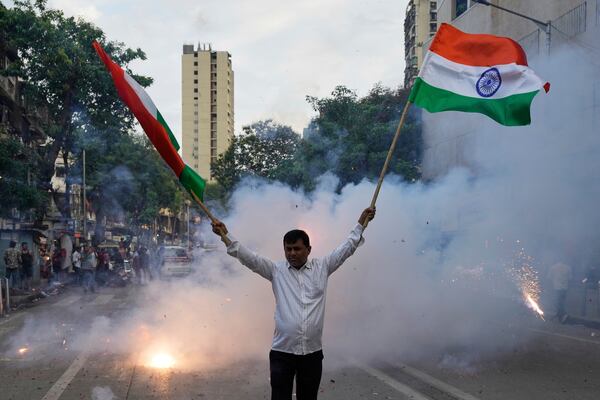 Shivsena party worker holding Indian national flag rally's in support of the Indian Army as they celebrate the success of 'Operation Sindoor', in Mumbai in Mumbai, India, Thursday, May 8, 2025. (AP Photo/Rajanish Kakade)