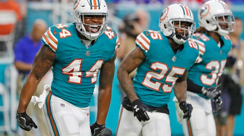 Miami Dolphins outside linebacker Stephone Anthony (44) celebrates after stopping Buffalo Bills fullback Mike Tolbert from getting a first down in the second quarter at the Hard Rock Stadium in Miami Gardens, Fla., on Sunday, Dec. 31, 2017. The Bills won, 22-16. (Al Diaz/Miami Herald/TNS)