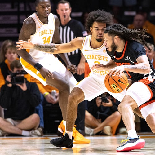 Mercer guard Zaire Williams (1) drives against Tennessee guard Ja'Kobi Gillespie (0) during the first half of an NCAA college basketball game Monday, Nov. 3, 2025, in Knoxville, Tenn. (AP Photo/Wade Payne)