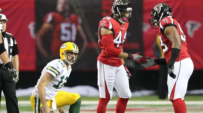 October 30, 2016 ATLANTA: Falcons Vic Beasley Jr. celebrates sacking Packers Aaron Rodgers with Dwight Freeney during the first half in an NFL football game on Sunday, Oct. 30, 2016, in Atlanta. Curtis Compton /ccompton@ajc.com